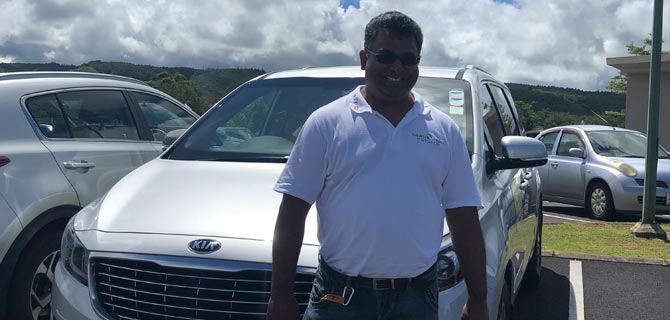 Ryad in front of his Taxi.